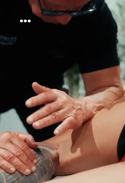 Derek Lyons performing sports massage treatment